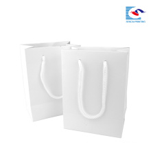 custom logo white glossy art paper hand paper packaging bag